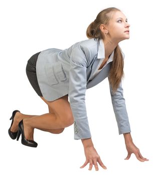 Businesswoman standing in running start pose, half-turn. Isolated over white background