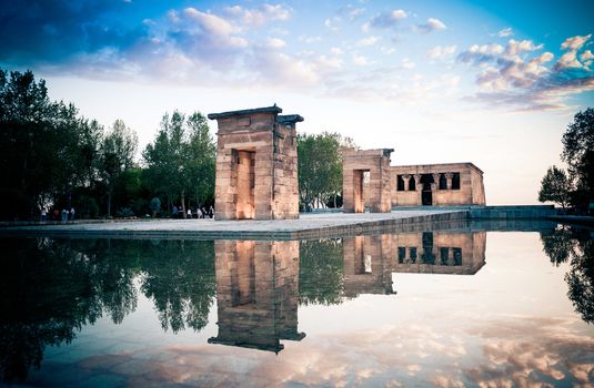 Madrid, Spain - May 10, The Temple of Debod (Templo de Debod) an ancient Egyptian temple rebuilt in Madrid with visiting tourists at dawn, Spain.