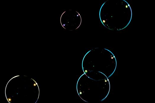 Group of soap bubbles on a black background