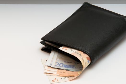 the photo is a wallet with money sticking out, the iimagine may represent an expense, or the value of the euro