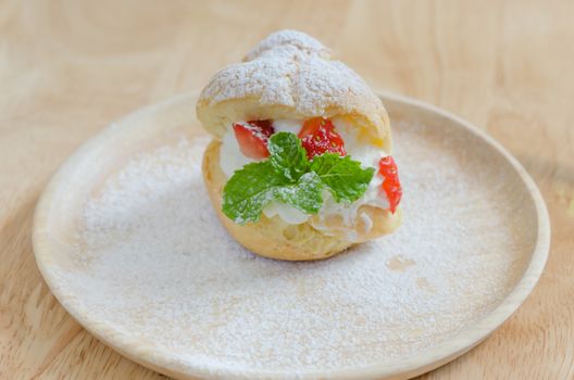fresh strawberry Choux Cream on wooden dish