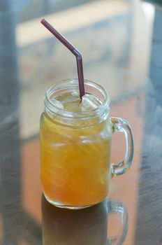 ice tea with drinking straw on the table