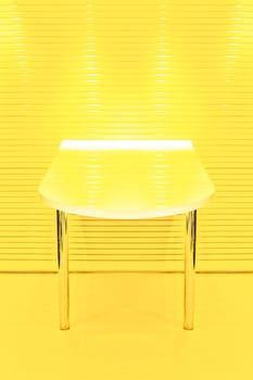 two legged table abstract in lemon yellow