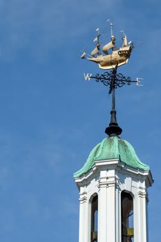 ornate weather vane on top of a bell tower
