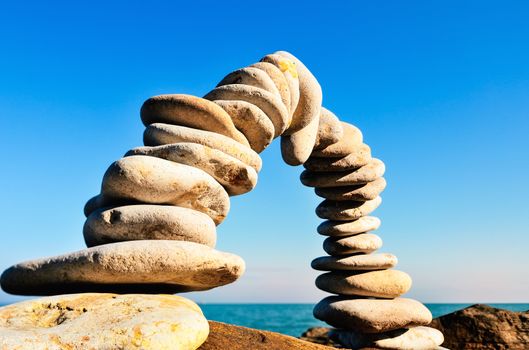 Stones laid out in the form of a arc on the seashore