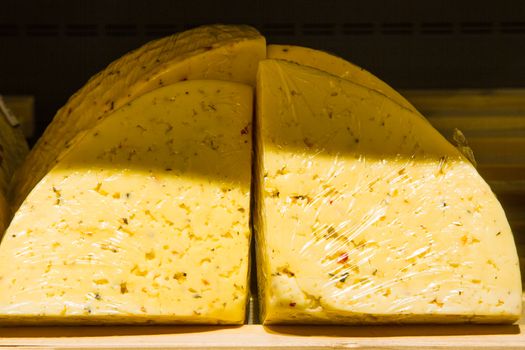 Cheese on a shelf in grocery store