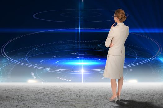Thinking businesswoman against blue glowing technology interface