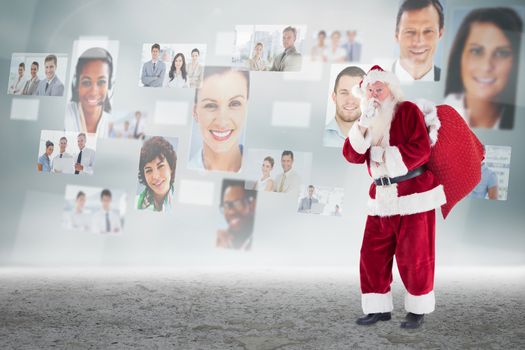 Santa keeping a secret against business people profiles