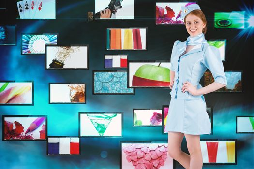 Pretty air hostess with hand on hip against screen collage showing lifestyle images