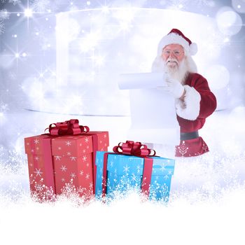 Father Christmas holds a list against snowflakes in room