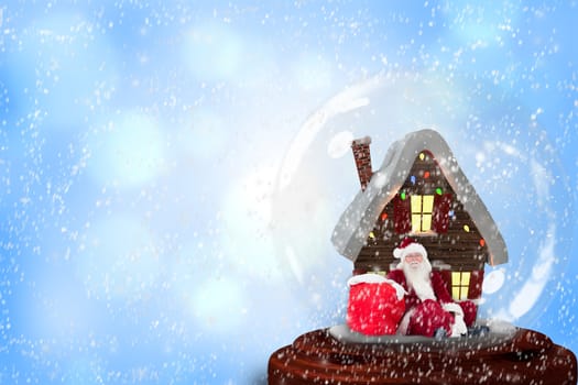 Santa sitting in snow globe against blue abstract light spot design