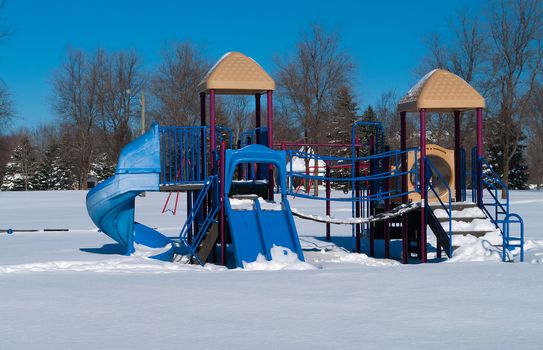 Park with playground equipment in the winter