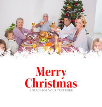 Family raising their glasses at christmas against merry christmas