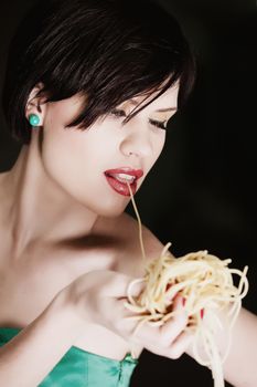 attractive woman with eating spaghetti. Concept idea 