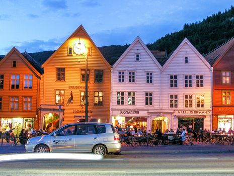 BERGEN, NORWAY - JULY 24, 2007: Tourists along city streets. More than 1 million people visit Bergen annually.