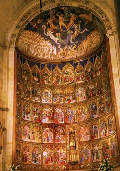 Ancient Apse House Old Salamanca Cathedral Castile Spain. 52 tablets completed in 1400s, 12 of which by Diego Delli, Italian artist, celebrating life of Jesus and Mary with fresco of final judgment above them.  Old Salamanca Cathedral next to the new Salamanca Cathedral is known as Catedral Vieja de Santa Maria.  Founded by Bishop Jerome of Perigold in the 1100s.  It was finished in the 1300s and dedicated to Saint Mary of the See 