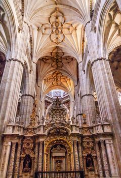 Stone Columns Angels and Mary Statues New Salamanca Cathedral Spain.  The New and Old Cathedrals in Salamanca are right next to each other.  New Cathedral was built from 1513 to 1733 and commissioned by Ferdinand V of Castile, Spain.