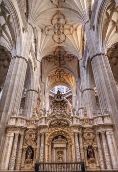 Stone Columns Angels and Mary Statues New Salamanca Cathedral Spain.  The New and Old Cathedrals in Salamanca are right next to each other.  New Cathedral was built from 1513 to 1733 and commissioned by Ferdinand V of Castile Spain.