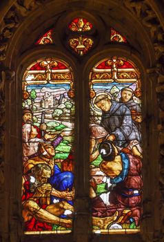 Spanish Preist Feeding Peasants Stained Glass Salamanca New Cathedral Castile Spain. The New and Old Cathedrals in Salamanca are right next to each other.  New Cathedral was built from 1513 to 1733 and commissioned by Ferdinand V of Castile, Spain.