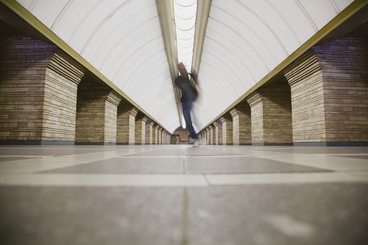 Blurred man on subway platform in a big city 