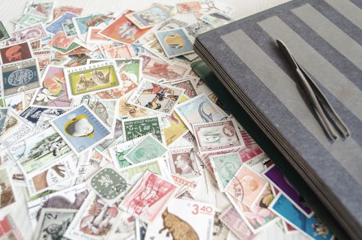 Backdrop of old worldwide postage stamps .