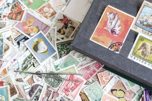 Backdrop of old worldwide postage stamps .
