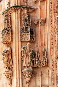 Stone Statues Doorway New Salamanca Cathedral Spain.  The New and Old Cathedrals in Salamanca are right next to each other.  New Cathedral was built from 1513 to 1733 and commissioned by Ferdinand V of Castile, Spain. 