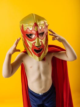 Photograph of a 4 year-old dressed as a Mexican wrestler or Luchador.
