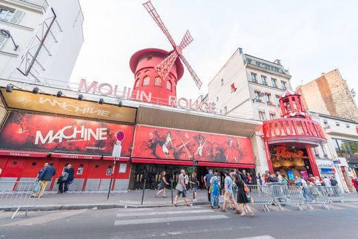 PARIS - JUNE 17, 2014: The Moulin Rouge in the evening. Moulin Rouge is a famous cabaret built in 1889, locating in the Paris red-light district of Pigalle.