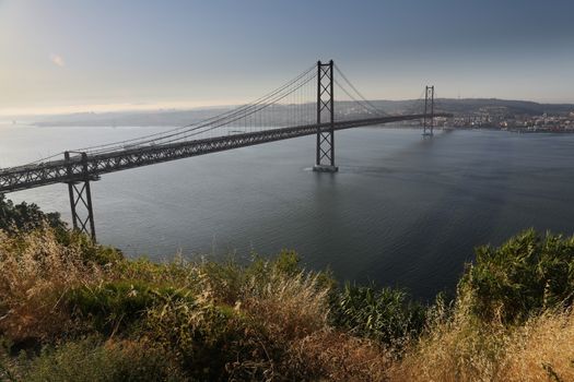 The "25 de Abril" bridge in Lisbon (Portugal) a copy of the  Golden Gate bridge.