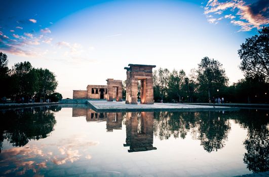 Madrid, Spain - May 10, The Temple of Debod (Templo de Debod) an ancient Egyptian temple rebuilt in Madrid with visiting tourists at dawn, Spain.