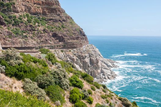 View of Chapmans Peak drive in the Table Mountain National Park in Cape Town, South Africa. Safety nets to keep rockfalls away fron the road are visible
