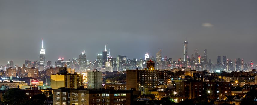 The view of Manhattan skyline at night from Queens, New York