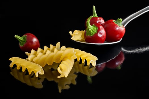 fusilli with peppers and spoon