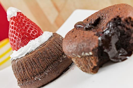 chocolate cake with soft heart and hat of santa claus