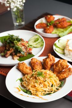 Thai style foods and stir fry dishes.  Shallow depth of field.