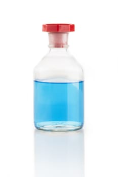 Clear glass bottle with blue liquid and red stopper.