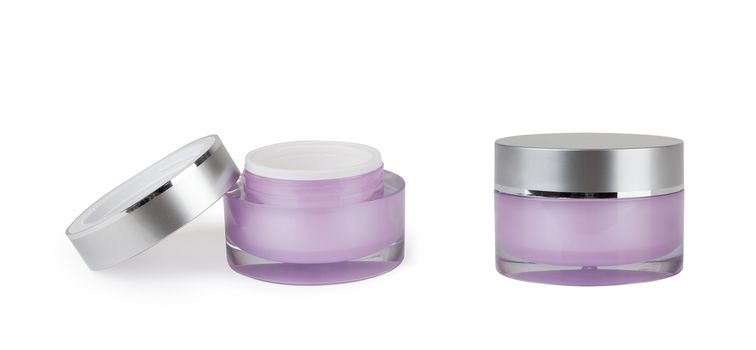 two purple containers of cream on white background