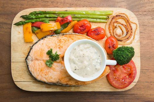 Salmon steak grilled with vegetable and Sour Cream Sauce