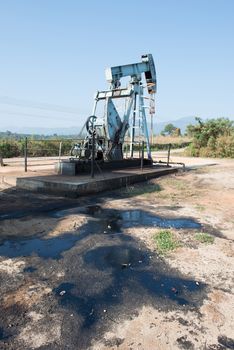 pump jack with crude oil contaminatate to environment