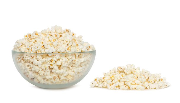 Delicious popcorn in bowl over white background