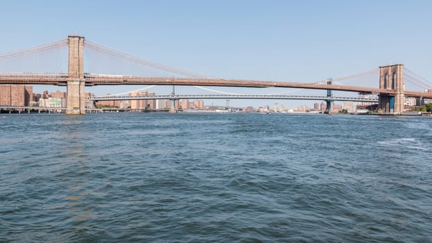 A view of Brooklyn bridge with Manhattan bridge in the background