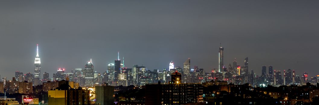 The view of Manhattan skyline at night from Queens, New York