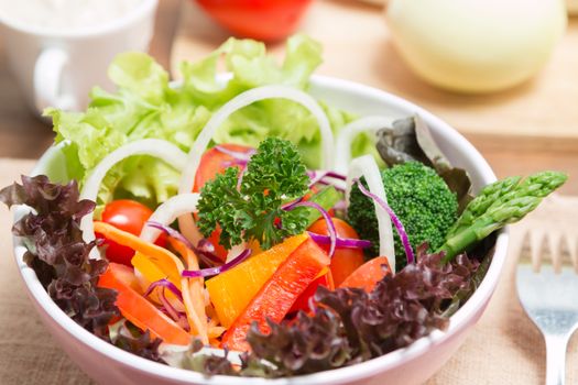 fresh vegetable salad on wood background