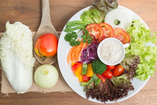 fresh vegetable salad on wood background