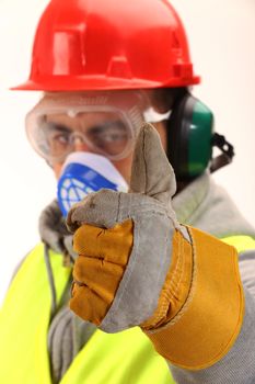 Worker with protective gear and thumbs up 