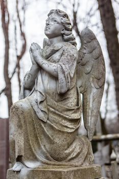 Old cemetery marble sculpture of the angel.