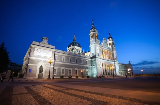 Madrid, Spain - May 10, 2012: Cathedral Almudena with tourists on a spring night in Madrid, Spain