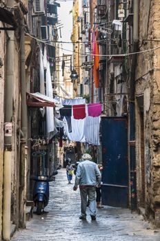 NAPLES - SEPTEMBER 28: narrow street in the historical downtown on September 28, 2013 in Naples, Italy 