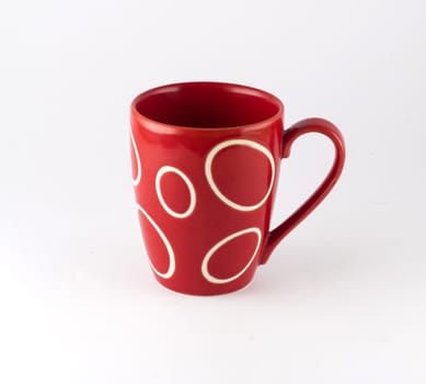 Red cup of tea isolated on white